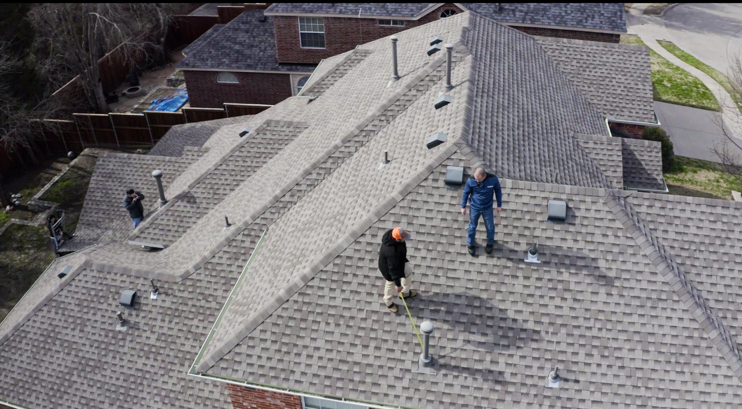 Licensed home inspector examining residential roof using advanced techniques Carroll County Maryland